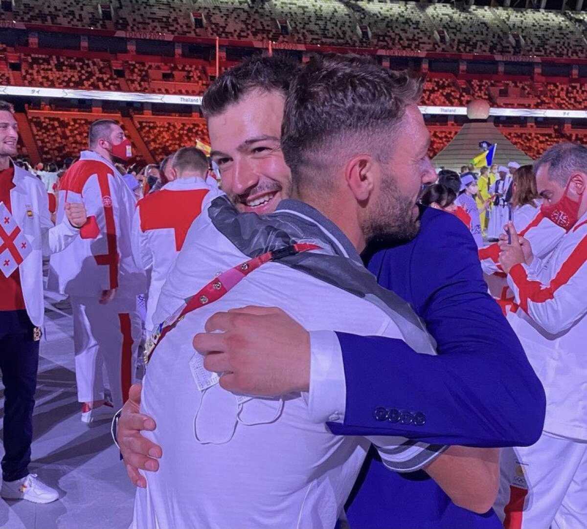A photo circulating on social media shows brothers Muhammad and Alaa Masu embracing during the opening ceremony of the 2020 Tokyo Olympics on Friday, 7/23/2021