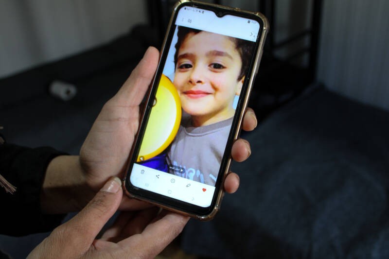Rihab al-Ahmad shows a photo of her son, six-year-old Saifuddin, who died during the family’s boat crossing from Lebanon to Cyprus, 27/03/2024 (Hanna Davis/Syria Direct)